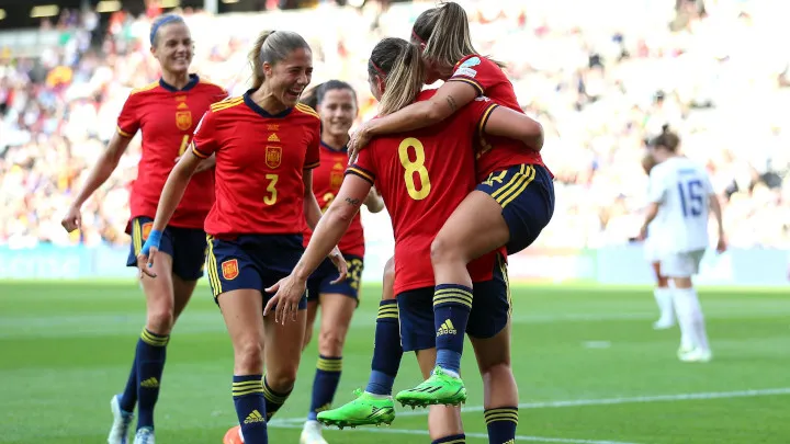 Spain's women's national football team celebrate a goal