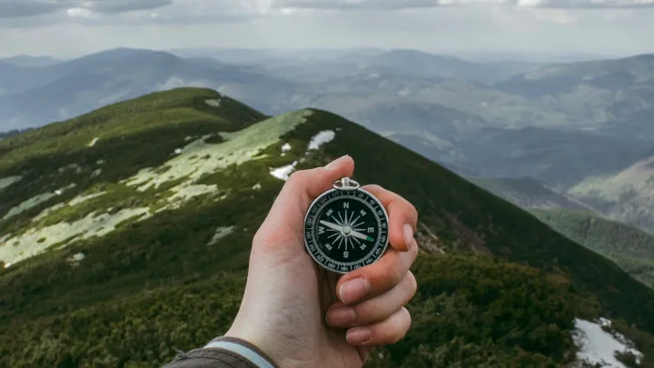 Man holding compass